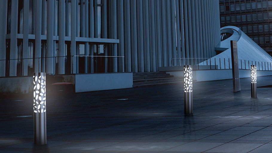 A night shot of R-6301 Austin Lighted Bollards installed at a public facility downtown