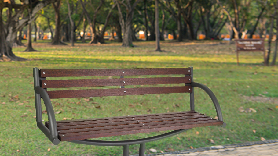 a wood bench in front of a grassy park