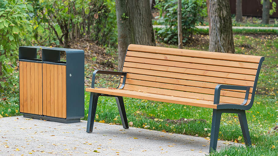 Various types of outdoor metal furnishings installed in a park