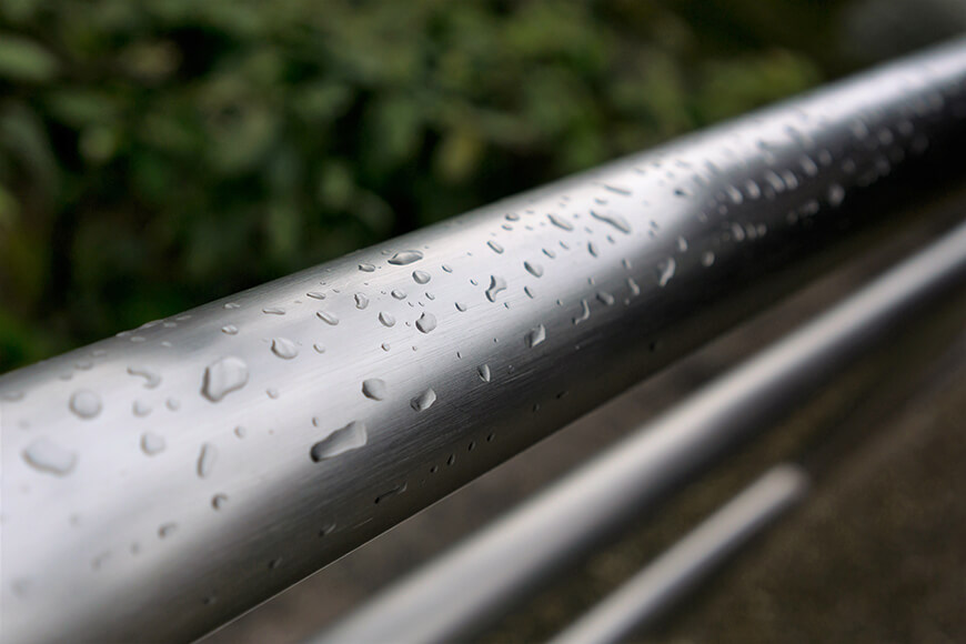 Water droplets on a stainless steel rail
