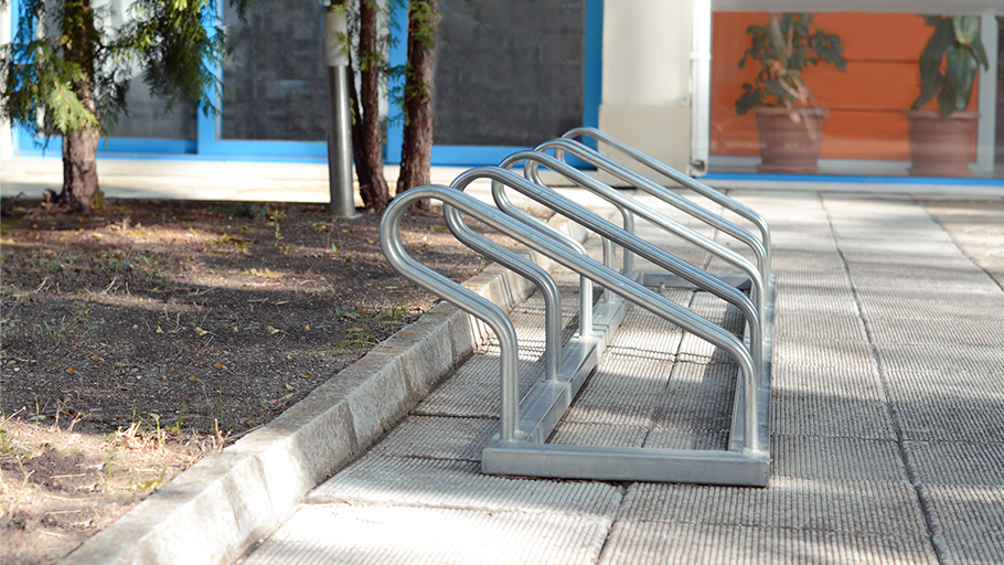 A metal bike rack that allows for multiple bicycles to be securely parked