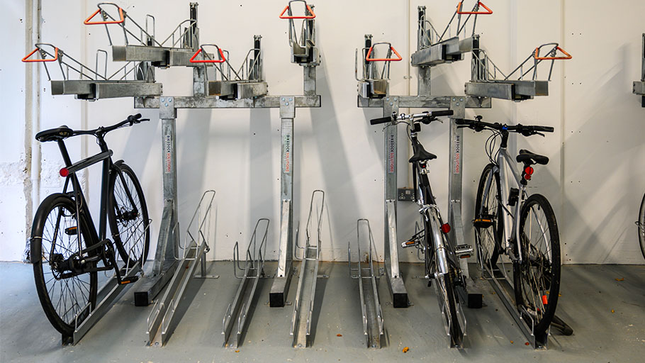 A multi-level bike rack system installed in a bike room.