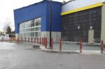 R-1007-08 steel pipe security bollards lined up in front of store
