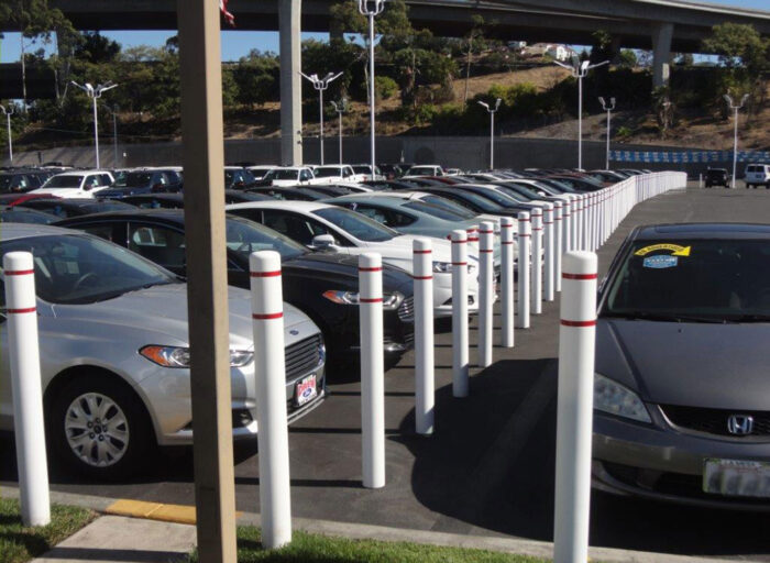 White R-7101 plastic bollard covers at parking lot