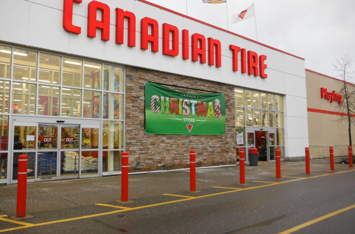 Red R-7109 plastic bollard covers in front of Canadian Tire store