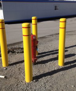 Four R-7111 plastic bollard covers protect fire hydrant