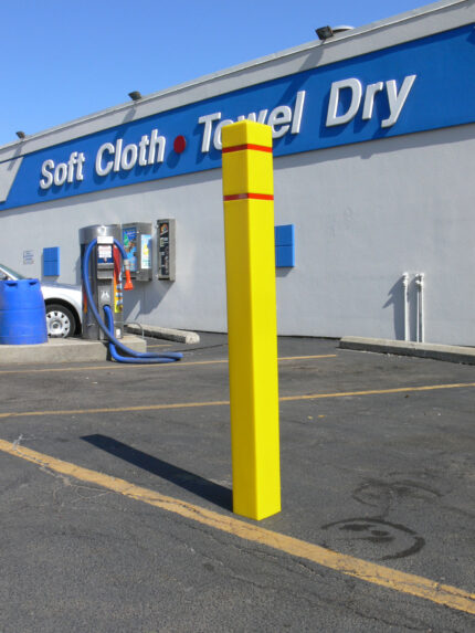 R-7150 plastic bollard cover in front of car wash business