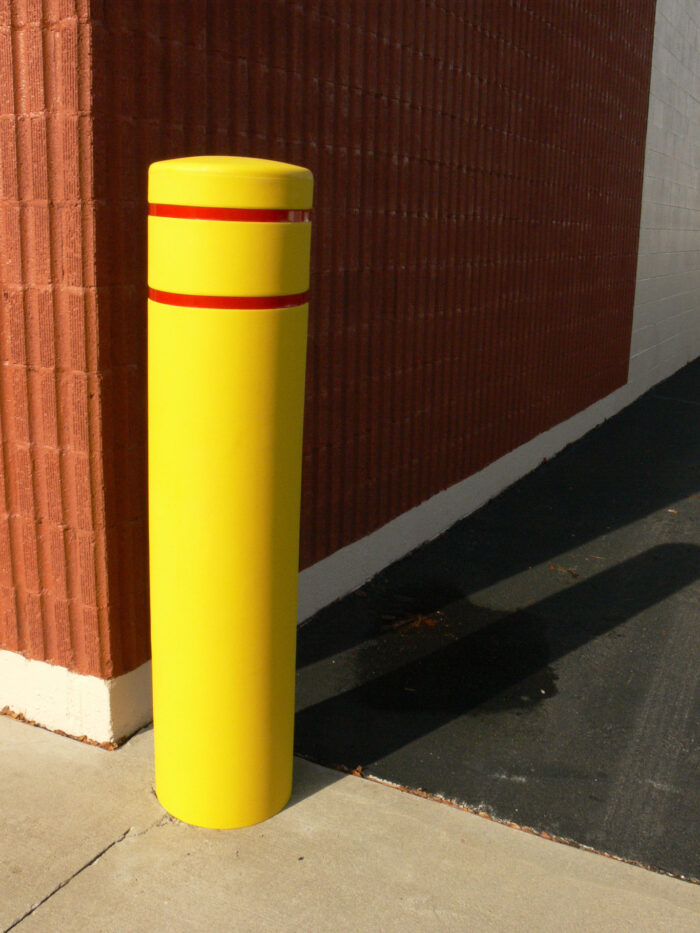 Yellow R-7155 plastic bollard cover on street corner