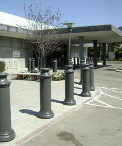 Row of R-7174 decorative plastic bollard covers at front of building