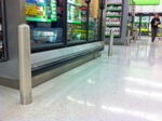 R-7186 bolt down bollards protect fridge at grocery store