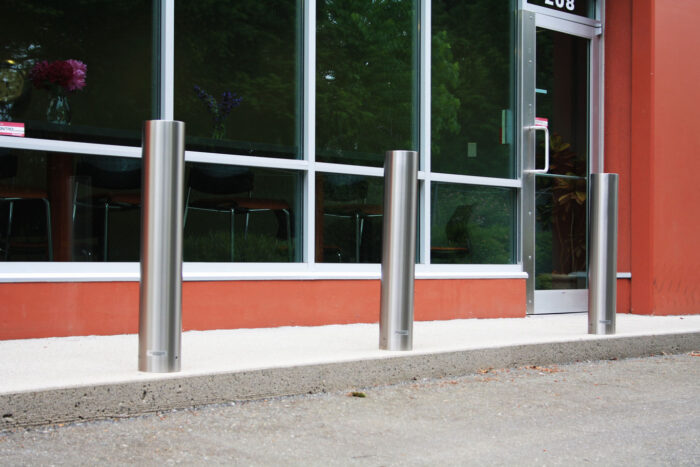 R-7303-EX stainless steel bollard covers protecting building entrance