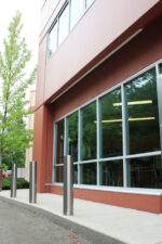 R-7303 stainless steel bollard covers in front of building windows