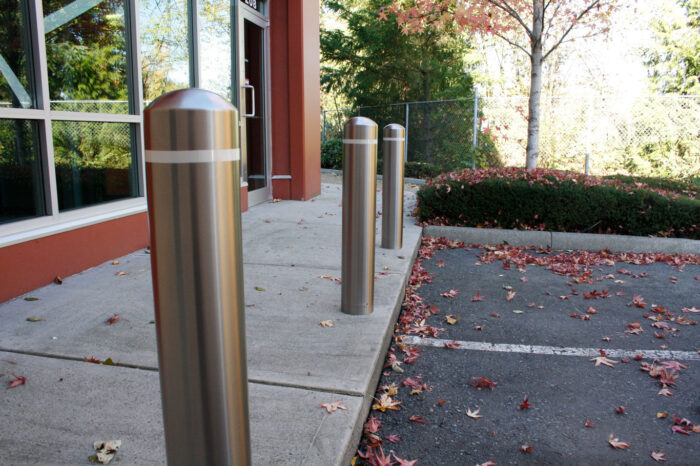 R-7305 stainless steel bollard covers in front of building