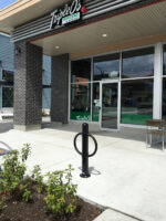 R-7906 post and ring bike bollard in front of restaurant