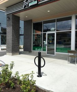 R-7906 post and ring bike bollard in front of restaurant
