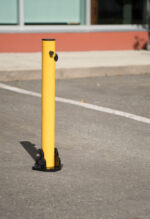 R-8430 collapsible bollard in parking lot