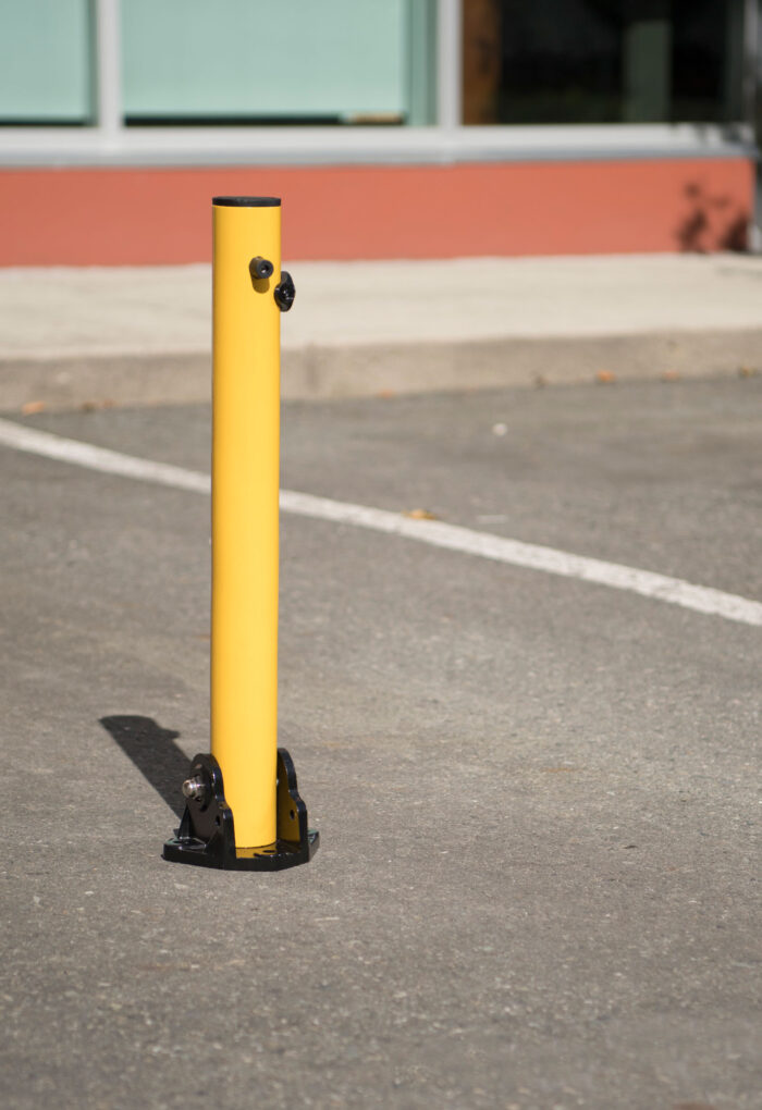 R-8430 collapsible bollard in parking lot