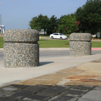 Two R-9701 concrete bollards