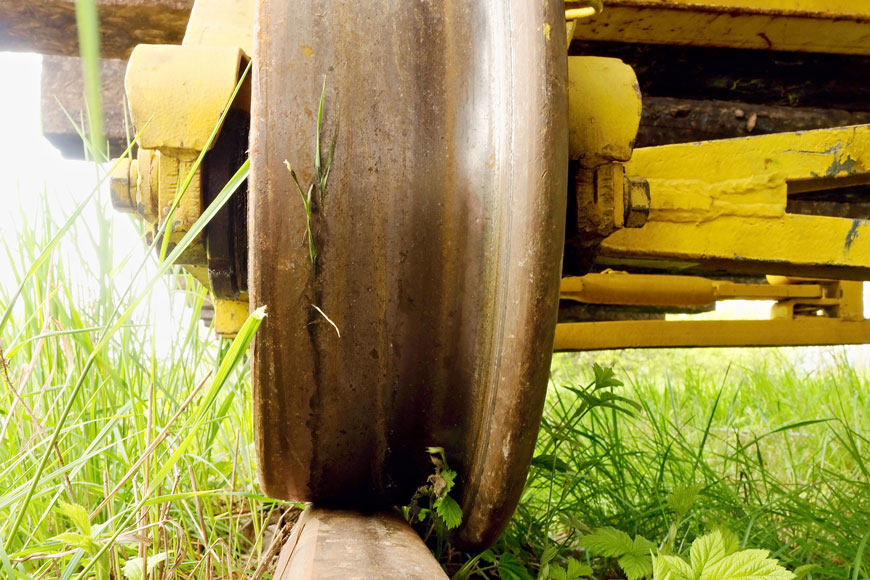 Single-flanged steel wheel on a track