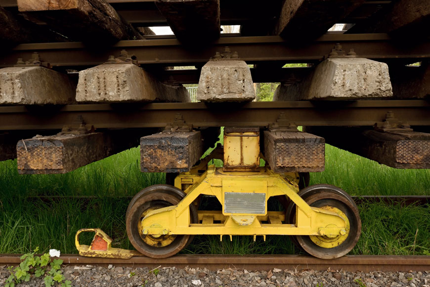 Steel track wheels carrying lumber load