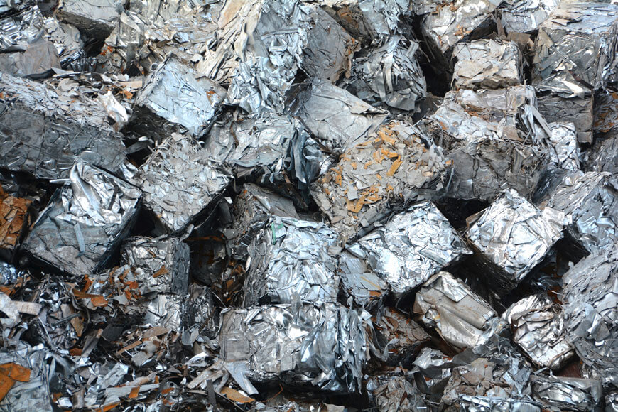Compressed metal at a metal recycling facility