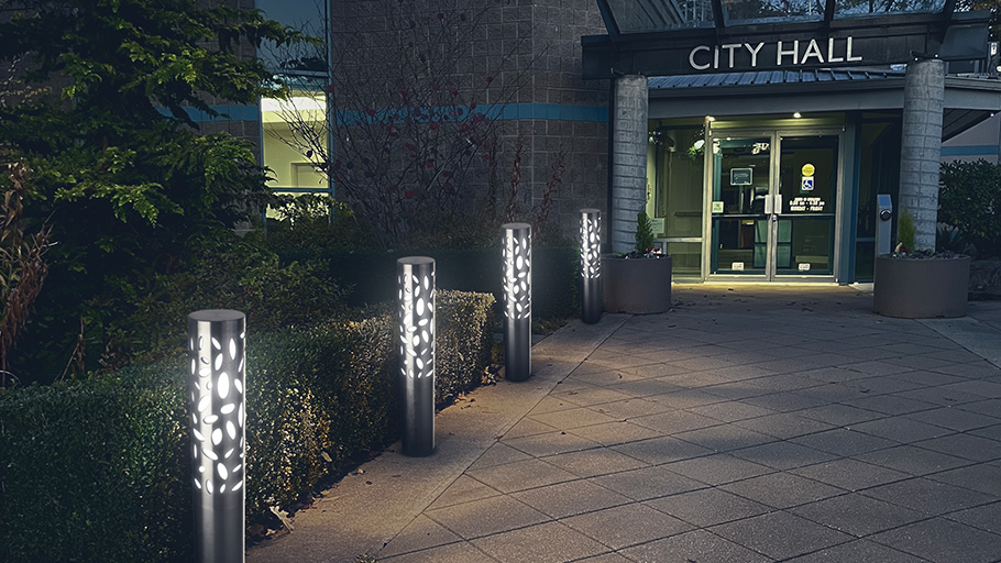 The R-6301 Austin Lighted Bollard illuminating the entryway to a city hall building.
