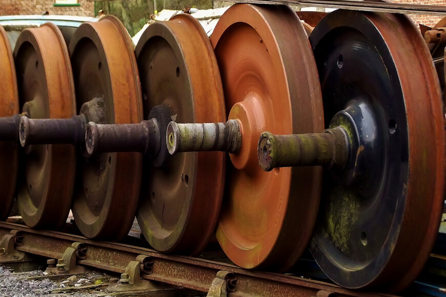 Numerous industrial wheels in a row outdoors