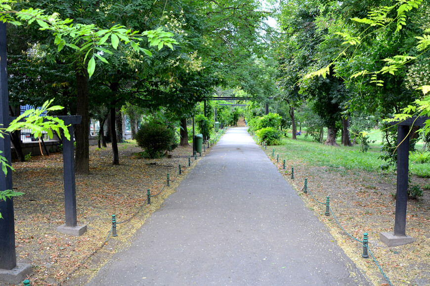 Landscape bollards lined outside an urban park aid in navigation of space