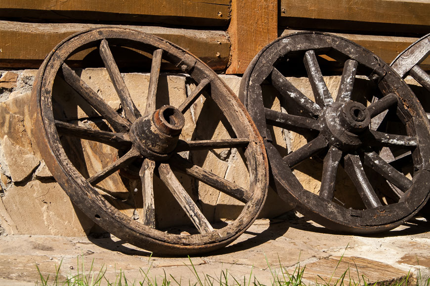 Old wooden cart wheels in close-up photo