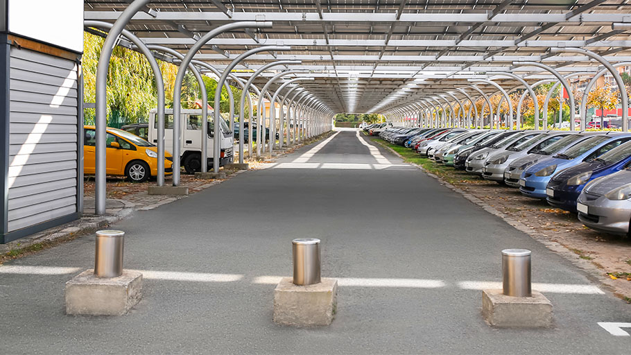 Bollards direct traffic and prevent access through one side of a parking lot