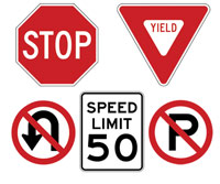 Variety of regulator signs including stop sign and speed limits