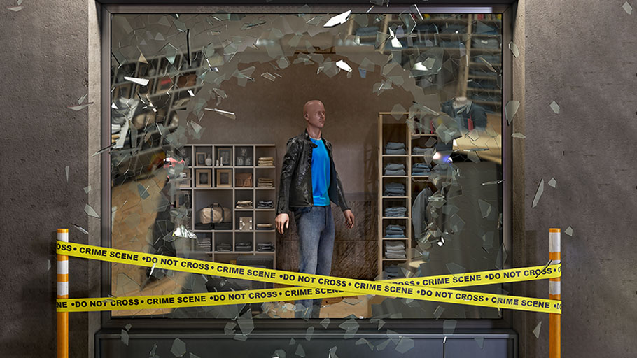 Shattered window of a retail clothing store with police tape, aftermath of a ram-raid.