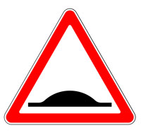 Red triangle with black bump speed bump warning sign