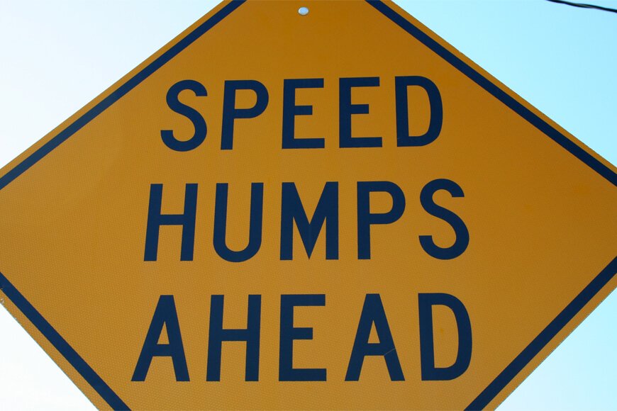 Speed humps ahead sign