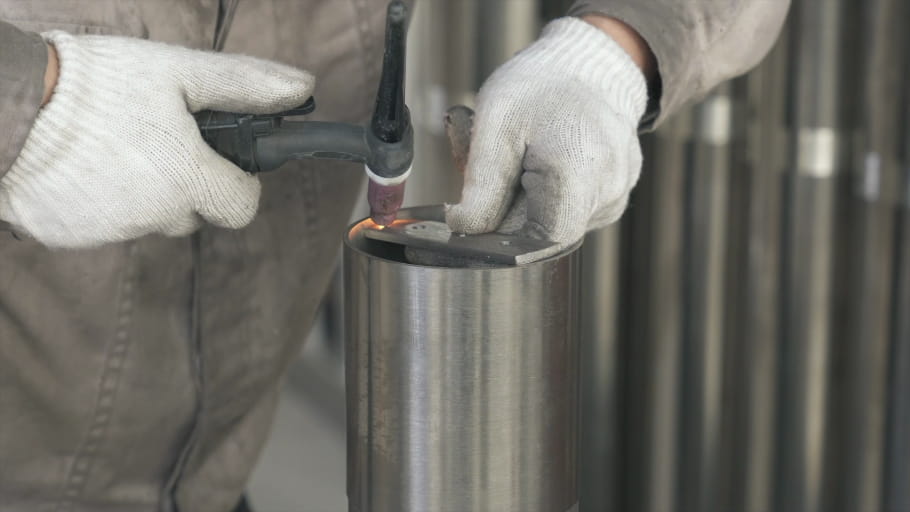 A mounting plate is welded onto a stainless steel bollard