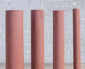 steel pipe bollards of varying sizes lined up