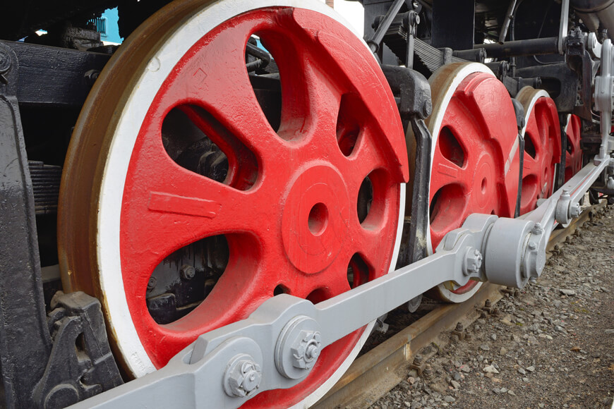 Red track wheels on a railroad track