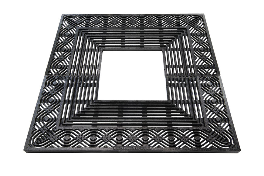 Ornate square tree grate made of cast iron in the United States