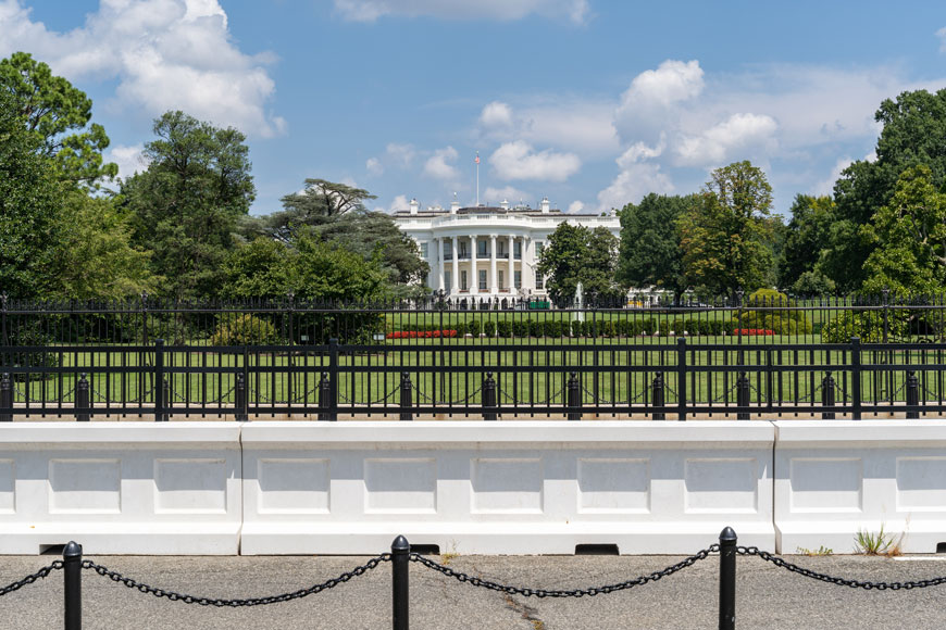 A series of anti-ram bollards and fences surround the White House in Washington, DC